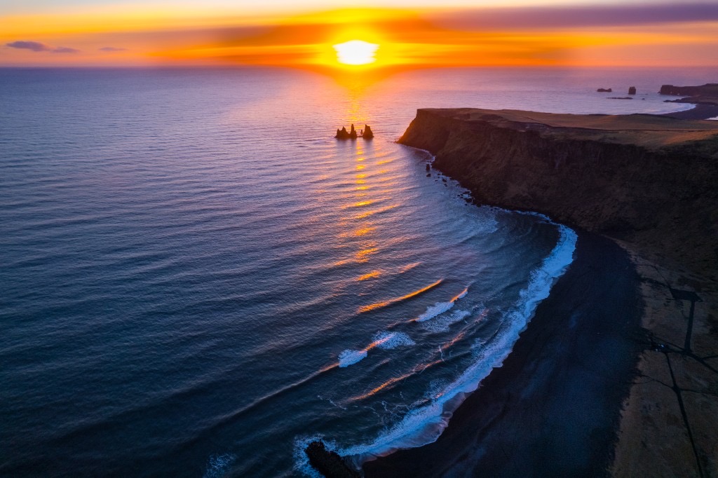 Black sand beach and sea stacks at sunset, Iceland